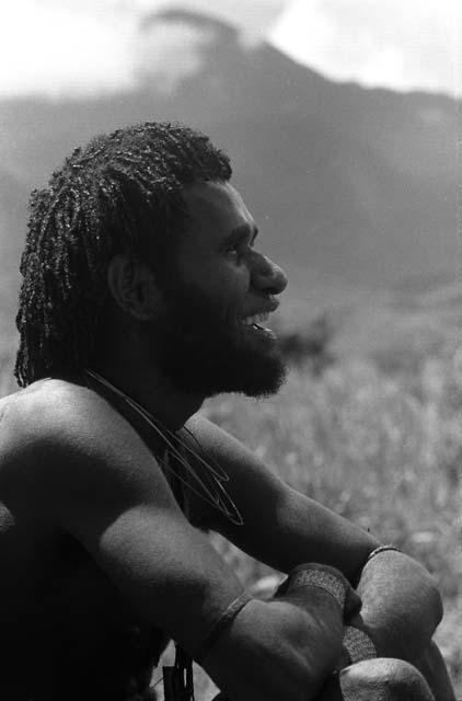 Samuel Putnam negatives, New Guinea; a man smiles; same man; portrait, side view