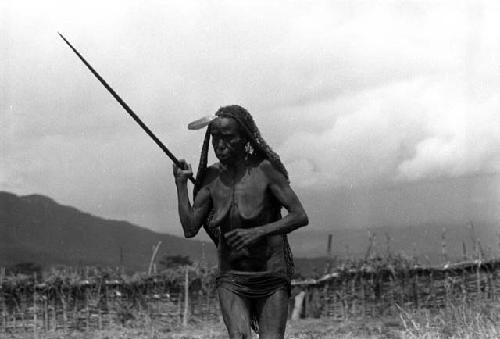 Samuel Putnam negatives, New Guinea; an old woman runs; dancing Etai