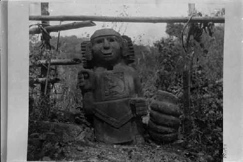 Carved stone statue, Tlaloc Ornetochtli. Carved "rabbit-snake" on chest of statue.