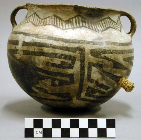 Black on white pottery handled jar