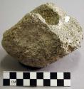 Ground stone mortar fragment