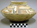 Ceramic jar, polychrome exterior, flared lip, rounded base, reconstructed