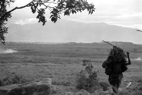 Samuel Putnam negatives, New Guinea; on the Anelerak; women walking up towards their sili