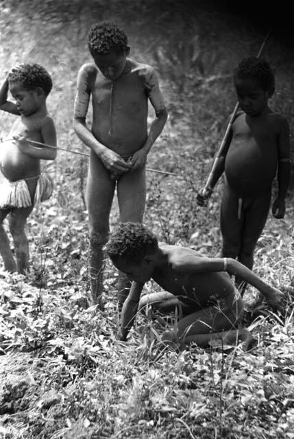 Samuel Putnam negatives, New Guinea; 4 children playing in a field
