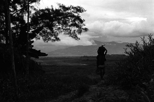 Samuel Putnam negatives, New Guinea; several women walking up the path towards Abukulmo past Homaklep