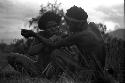 Samuel Putnam negatives, New Guinea; a man working an tekan for Aloro; it is Mu