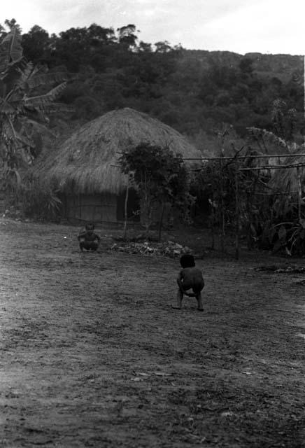 Samuel Putnam negatives, New Guinea; Natorek playing with another girl in Wuperainma