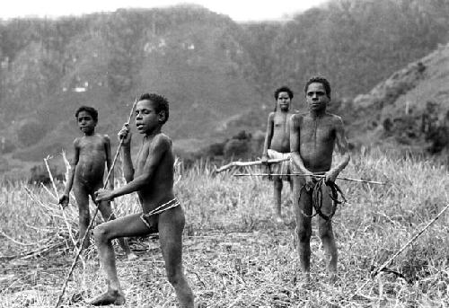 Samuel Putnam negatives, New Guinea; boys playing sikoko wasin; Isile and Okal