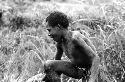 Samuel Putnam negatives, New Guinea; one boy in a mob of boys wrestling