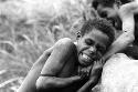 Samuel Putnam negatives, New Guinea; one boy in a mob of boys wrestling