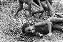 Samuel Putnam negatives, New Guinea; boys rolling on the ground