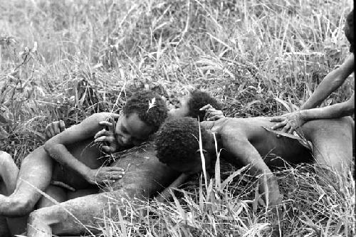 Samuel Putnam negatives, New Guinea; boys rolling on the ground