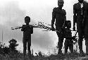 Samuel Putnam negatives, New Guinea; little boys and men watch the battle