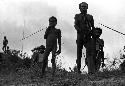 Samuel Putnam negatives, New Guinea; little boys and men watch the battle