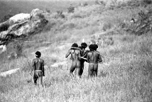 Samuel Putnam negatives, New Guinea; a man being carried back to a safe place to be operated on