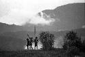 Samuel Putnam negatives, New Guinea; the middle of the Warabara on the highest knoll; 3 men stay; still shouting insults at the enemy