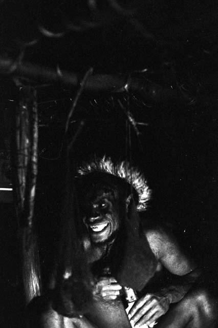 Samuel Putnam negatives, New Guinea; a man smiling in a honai