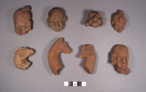 8 pottery head effigies: 5 human, 3 animal