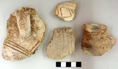 Ceramic sherds, impressed and incised designs, rim with handle