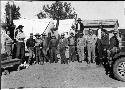 Group of people standing in front of tents at Awatovi