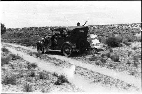 Two men riding in an automobile