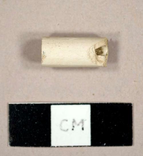 White kaolin pipe stem fragment