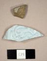 Gray stoneware sherd and grey basalt sherds with molded exterior and lead glazed interior
