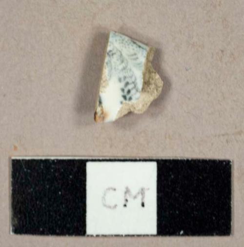 Whiteware rim sherd to a saucer with black transfer print