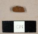 Earthenware sherd with brown, lusterous glaze on exterior and white lead glaze on interior