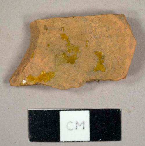 Refined red earthenware sherd with traces of lead glaze on both sides