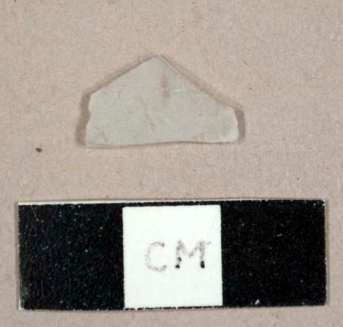 Frosted colorless glass fragment, possibly from a hurricane lamp