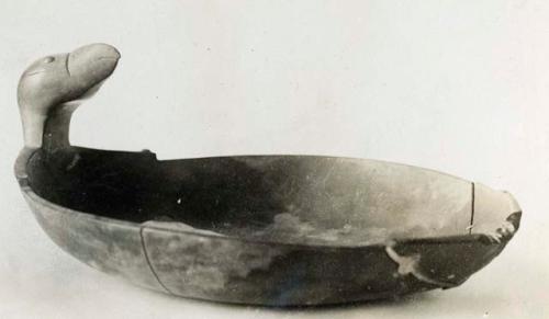 Wooden bowl with duck head attached, probably broken on one side