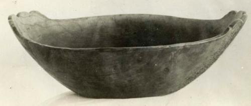 Wooden bowl, with flower-like indentions on two edges