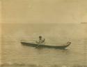 Inuit man paddling a kayak