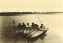 Six Inuit men in kayaks