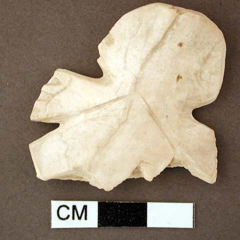 Shell effigy fragment, carved and incised, possibly human image