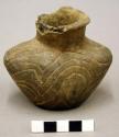 Small pottery bottle, decoration of interlockingscroll (typical caddo) unusual s