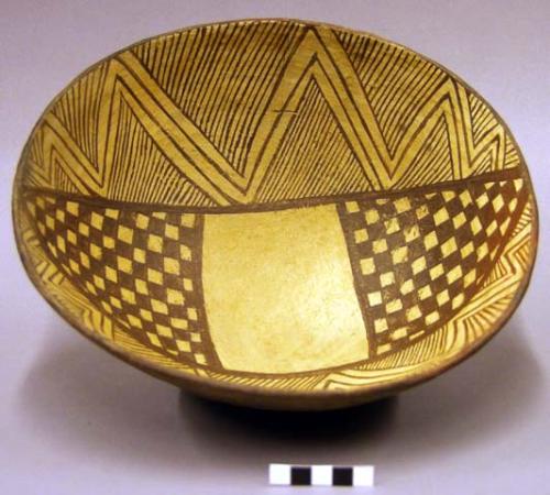 Bowl, brown on beige geometric design on interior, plain exterior,