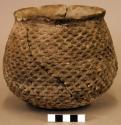 Ceramic jar, corrugated, flared rim, heavily mended