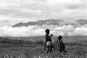 Samuel Putnam negatives, New Guinea; small girl and woman out in the fields