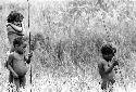 Samuel Putnam negatives, New Guinea; Namelike and 2 little boys just outside of the sili in Wuperainma