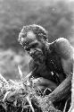 Samuel Putnam negatives, New Guinea; Alugu working in his garden