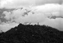 Samuel Putnam negatives, New Guinea; children behind Homaklep watching pigs; clouds behind