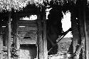 Samuel Putnam negatives, New Guinea; woman leaving sili