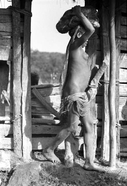 Samuel Putnam negatives, New Guinea; woman leaving sili