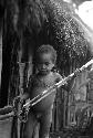 Samuel Putnam negatives, New Guinea; a boy about to play; sikoko; two spears and a hoop in his hand