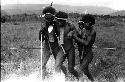 Samuel Putnam negatives, New Guinea; warrior being helped back from the Tokolik