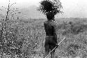 Samuel Putnam negatives, New Guinea; a warrior with things over his head - grass and ferns