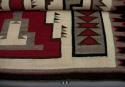 Navajo rug with geometric design; gray, black, red and white wool