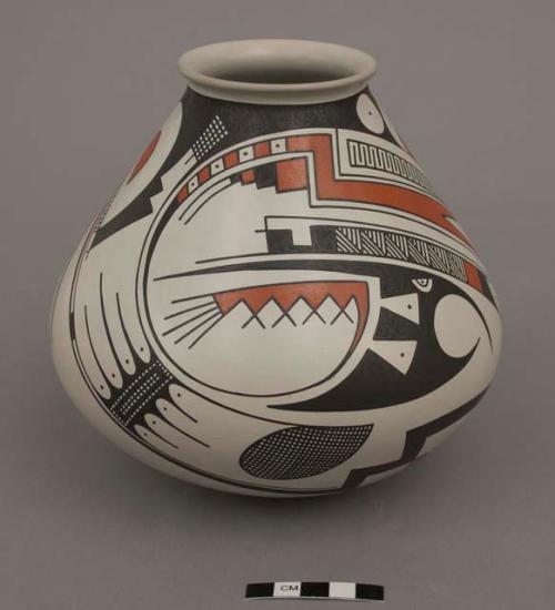 Jar; black and orange encircling design on white ground; rounded bottom; signed on bottom